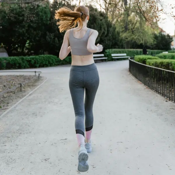 A woman running in compression gear