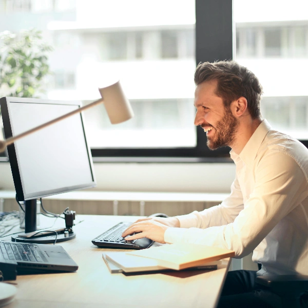 A man sitting at desk in office