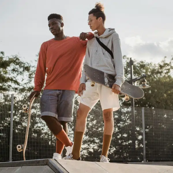 People wearing compression socks while board skating