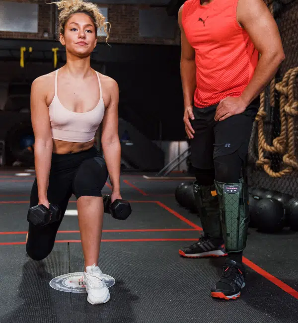 A man and a woman in a gym