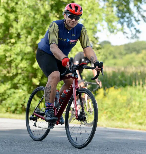 A man riding a bike down a curvy road