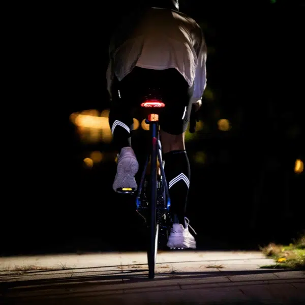 A man wears pressure socks while cycling