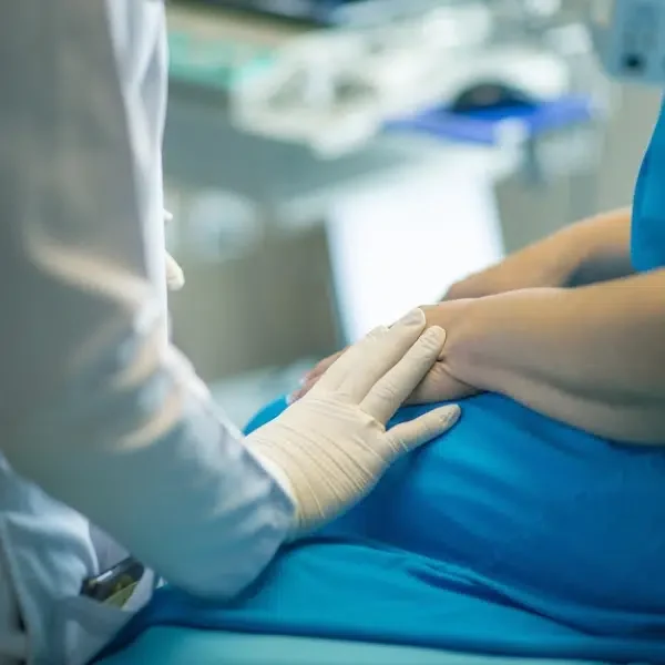 A woman is consulting with doctor.