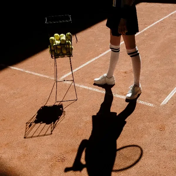 Person playing tennis in compression socks