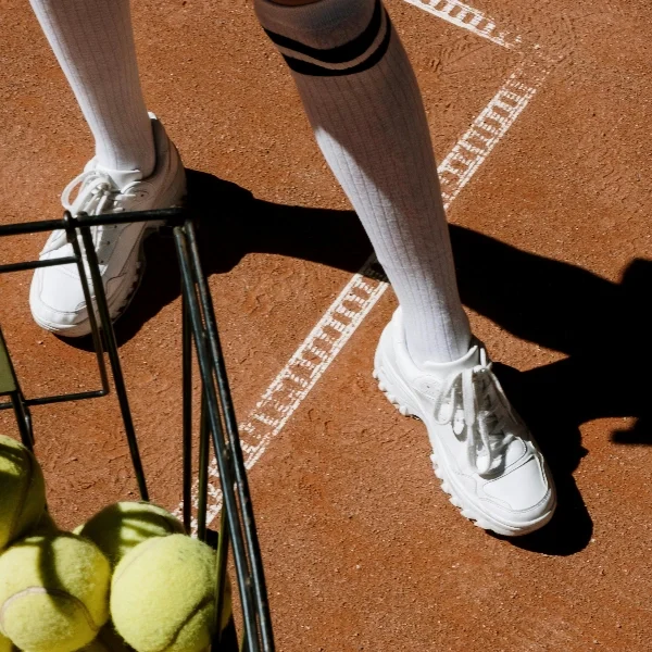 Playing tennis in compression socks