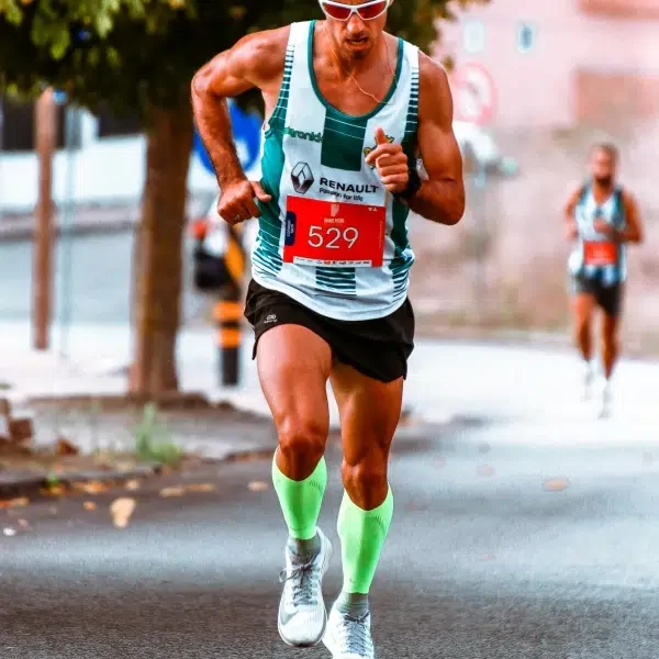 A man running in compression socks